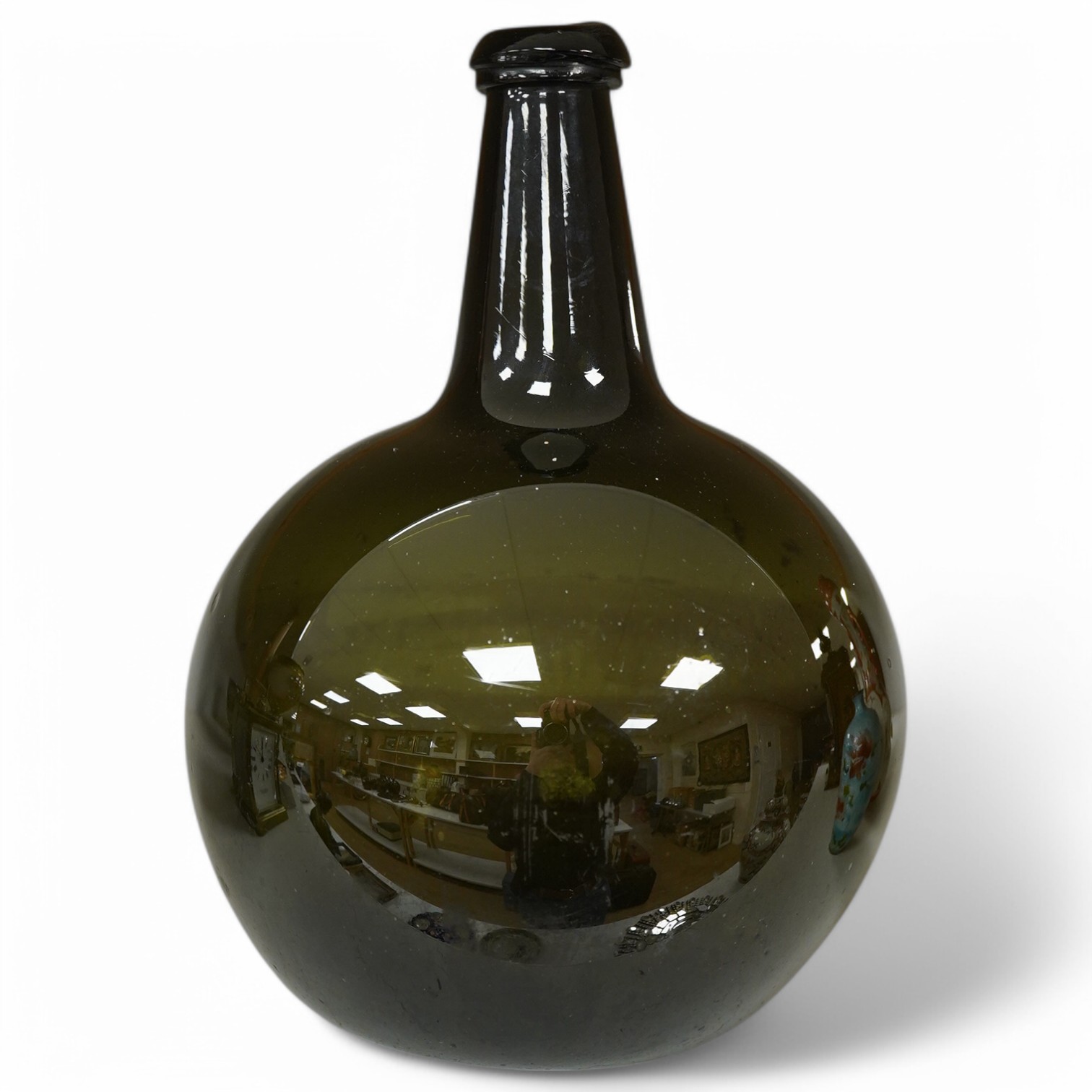 A small Georgian green glass bottle/carboy, 30cm high. Condition - fair to good.